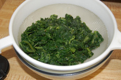draining spinach